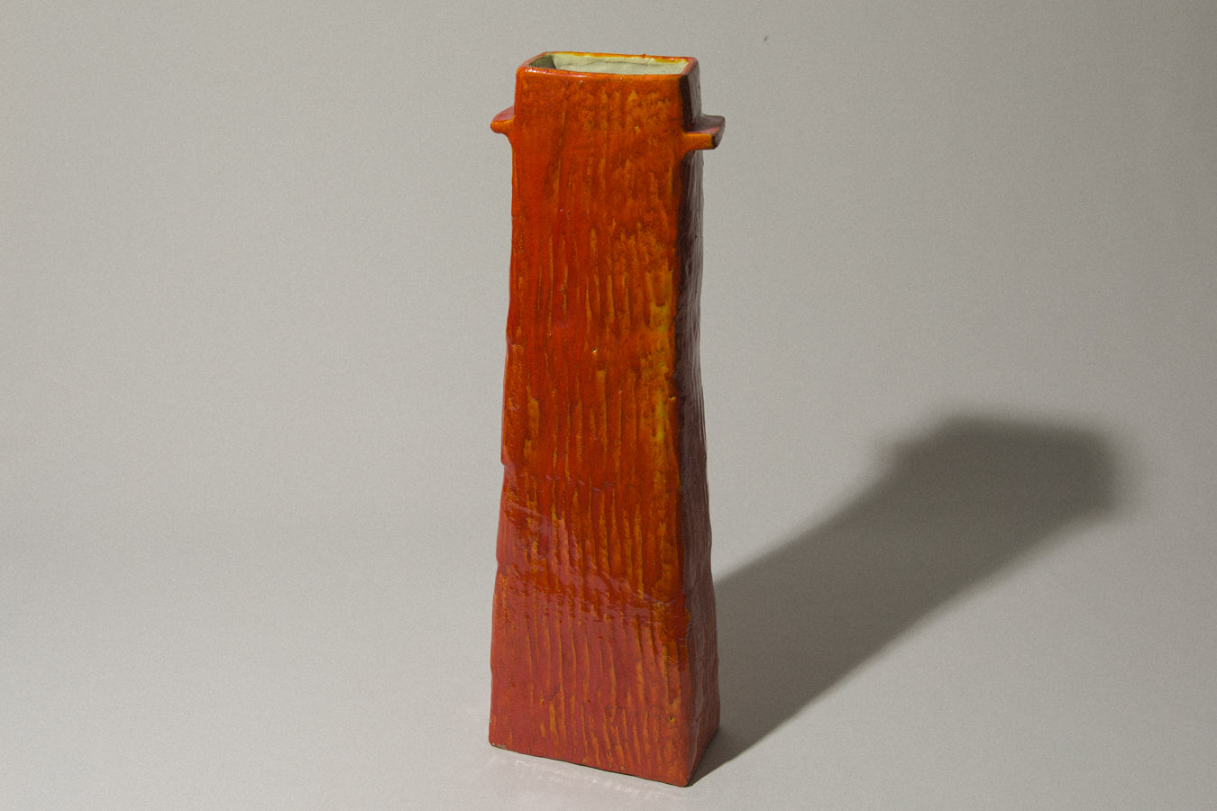 Orange rectangular VASE with handles by Béla Mihály
