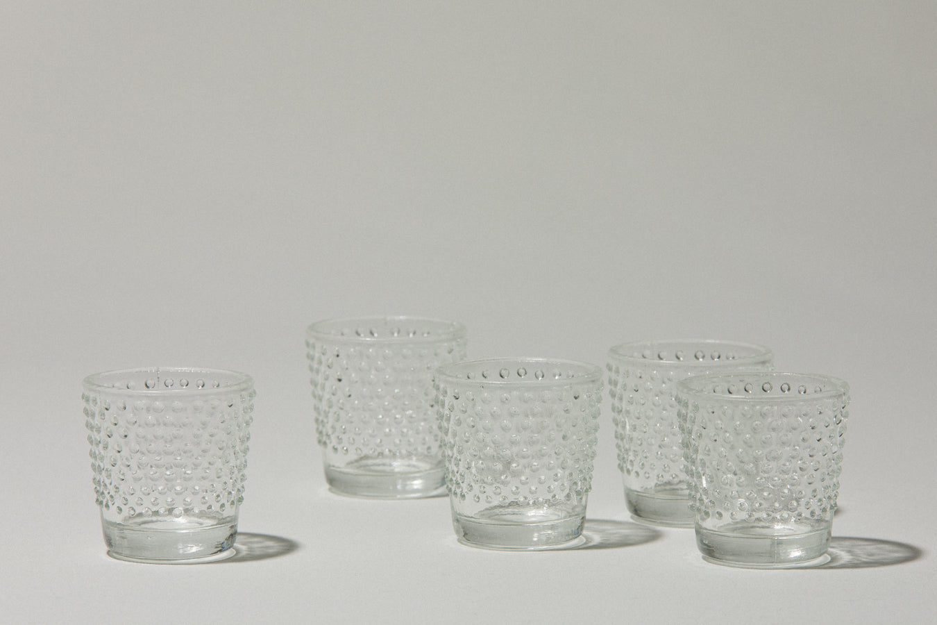 Set of five glass TUMBLERS