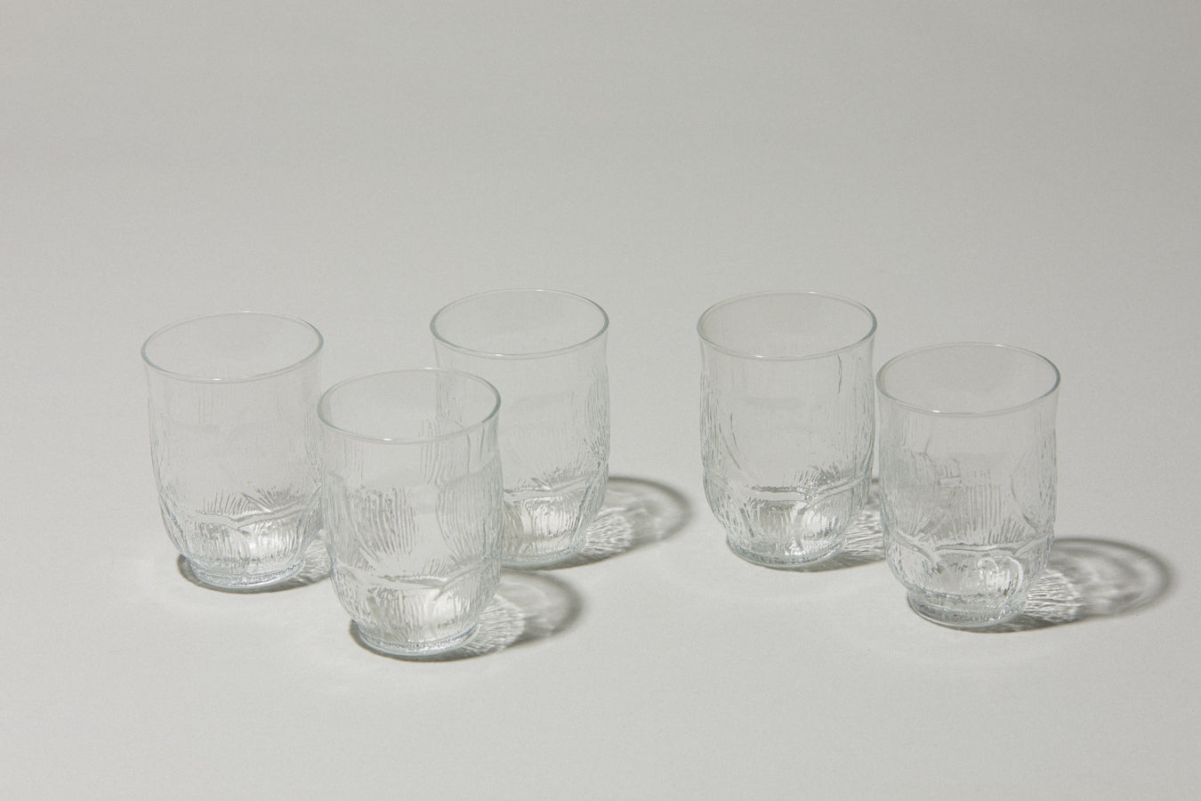 Set of five glass TUMBLERS