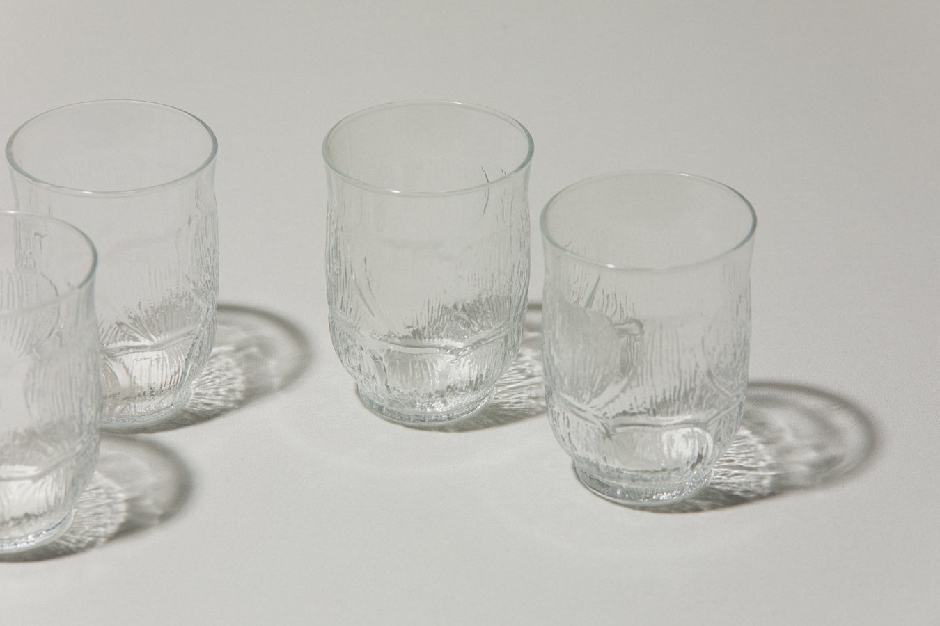 Set of five glass TUMBLERS