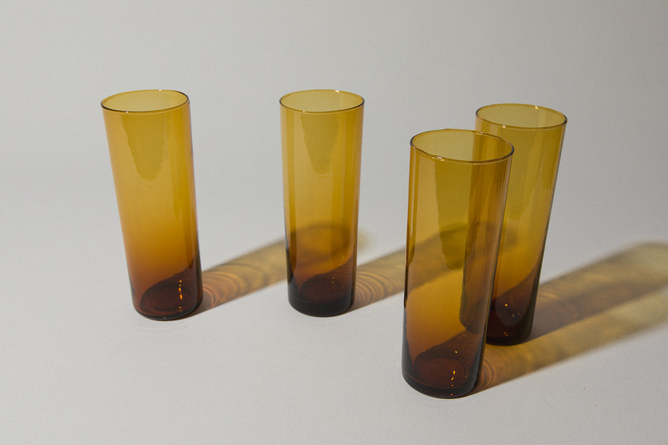 Set of four amber drinking GLASSES tall
