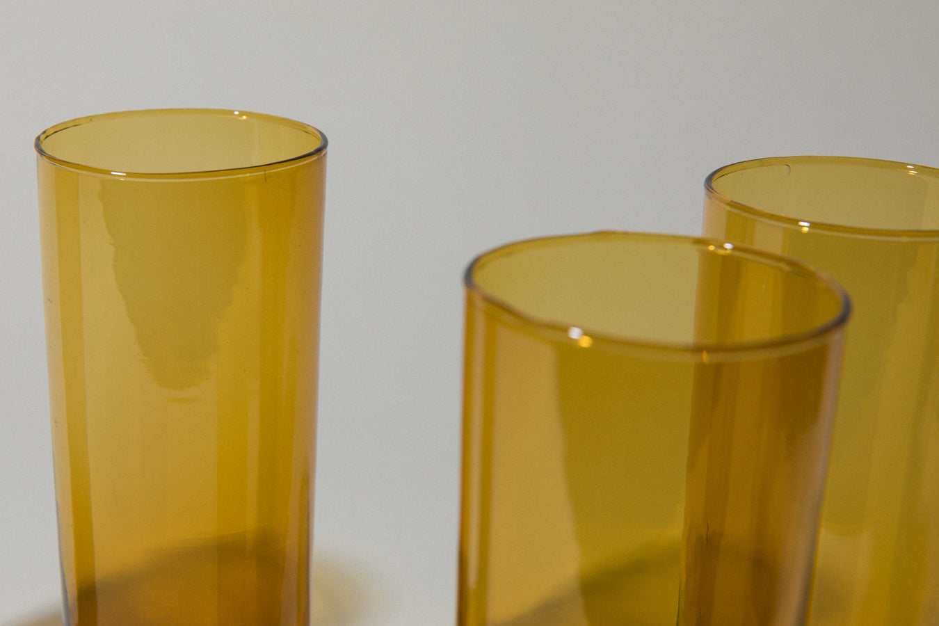 Set of four amber drinking GLASSES tall