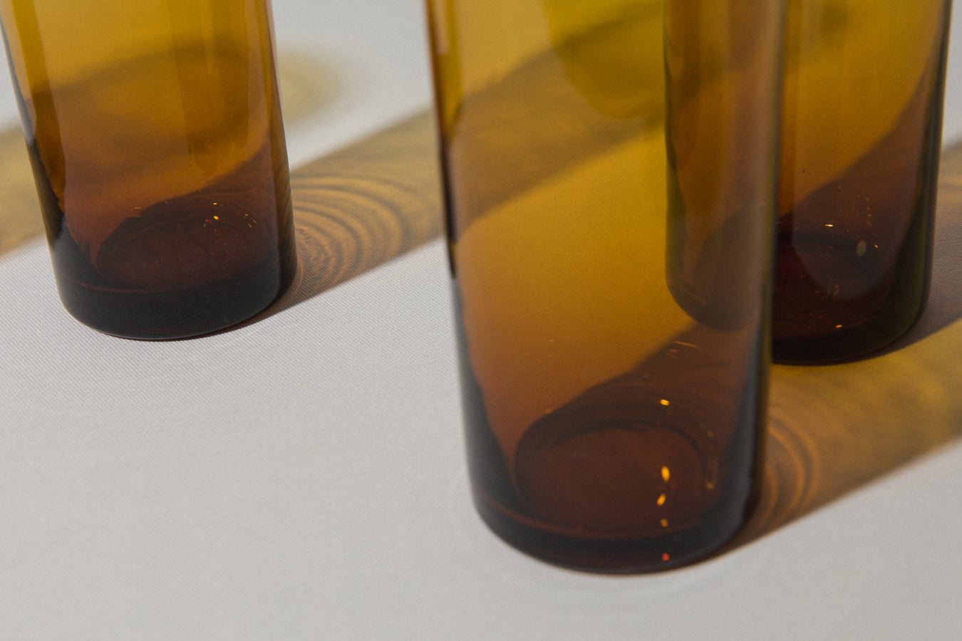 Set of four amber drinking GLASSES tall