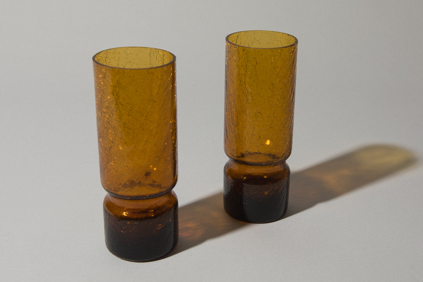 Set of two amber crackled glass TUMBLERS