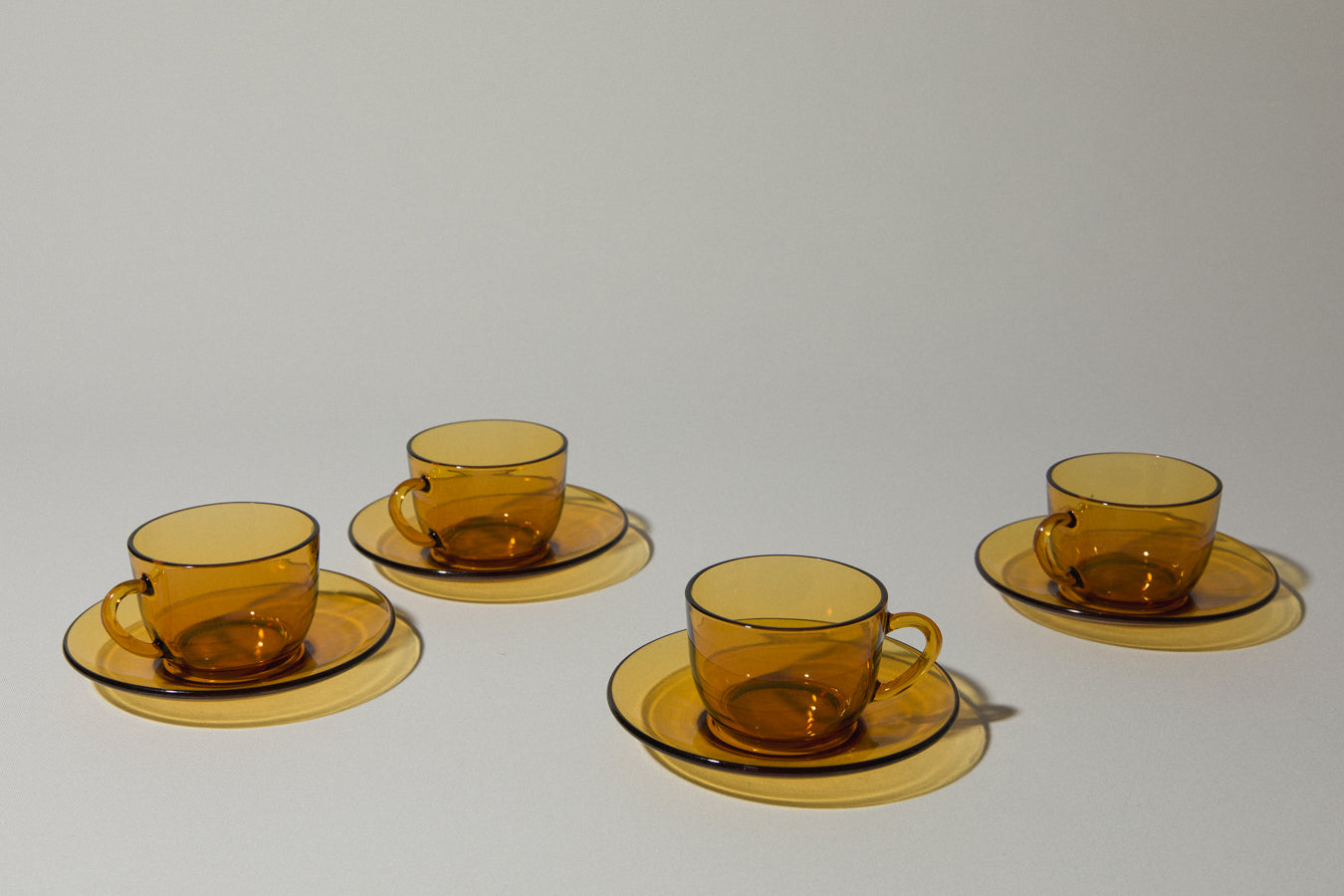 Set of four amber glass COFFEE CUP & SAUCER