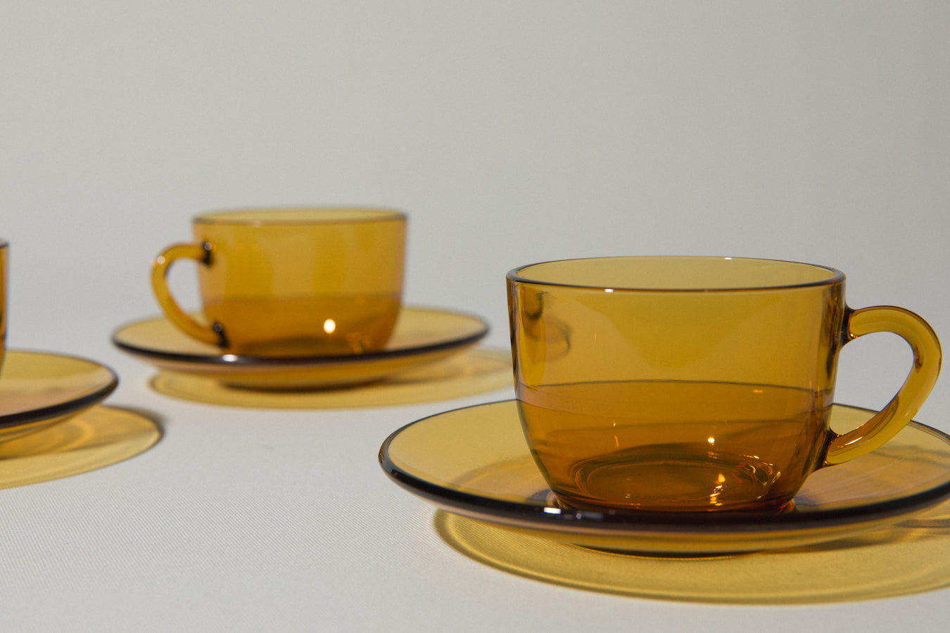 Set of four amber glass COFFEE CUP & SAUCER