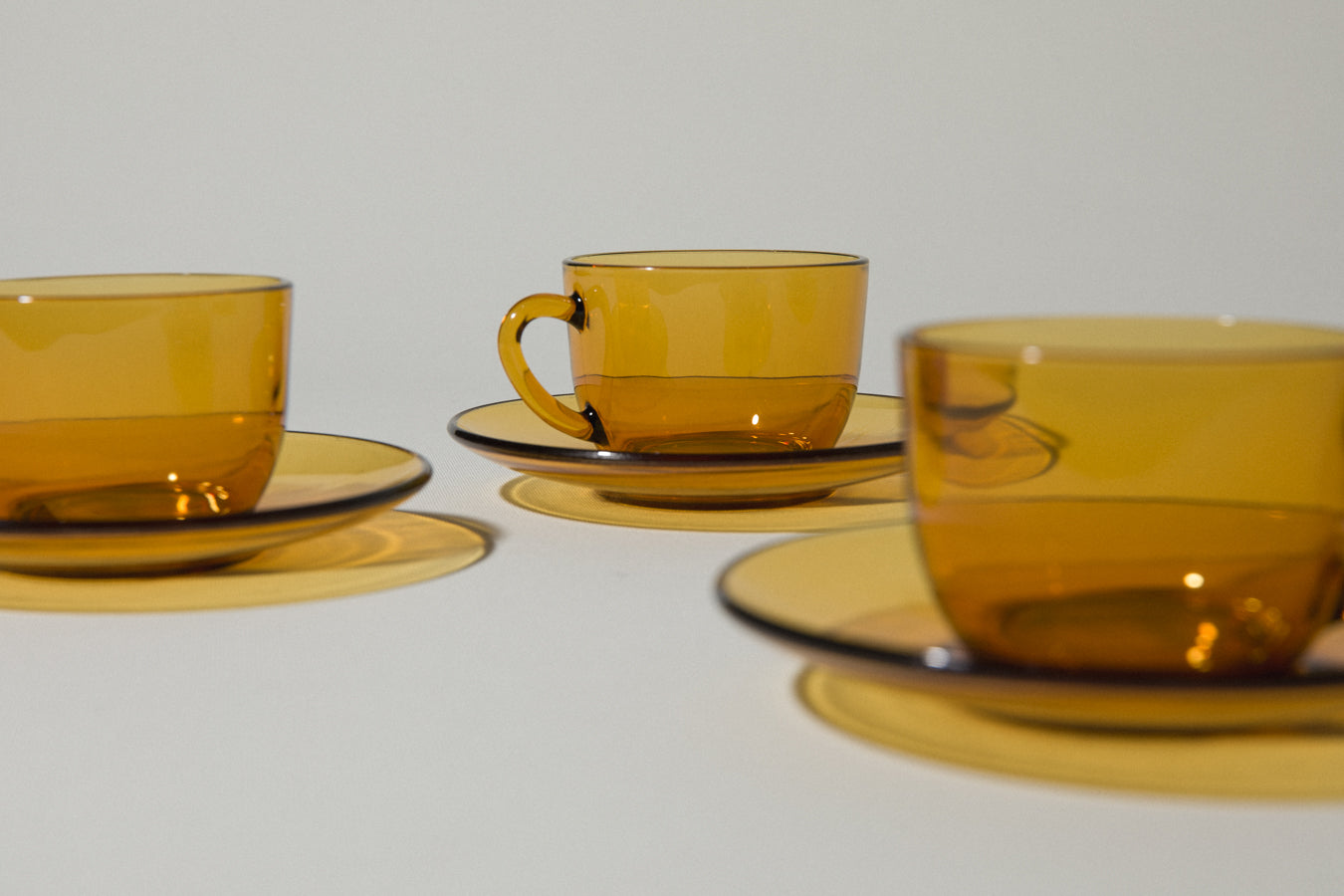 Set of four amber glass COFFEE CUP & SAUCER