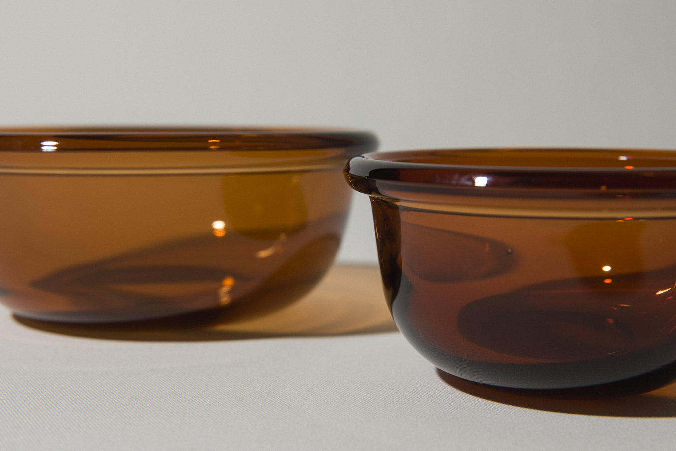 Set of two amber glass BOWLS