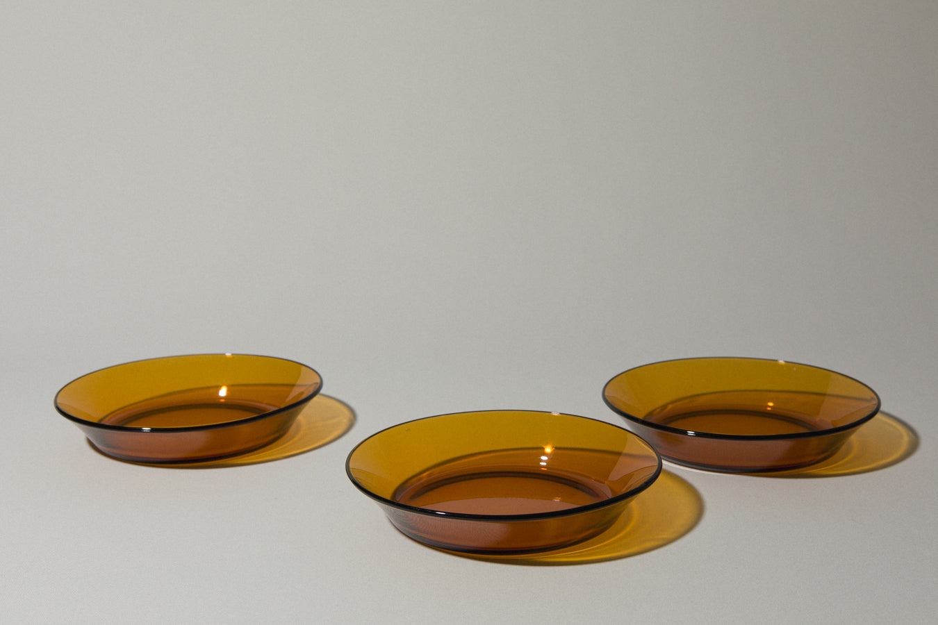 Set of three amber SOUP PLATES