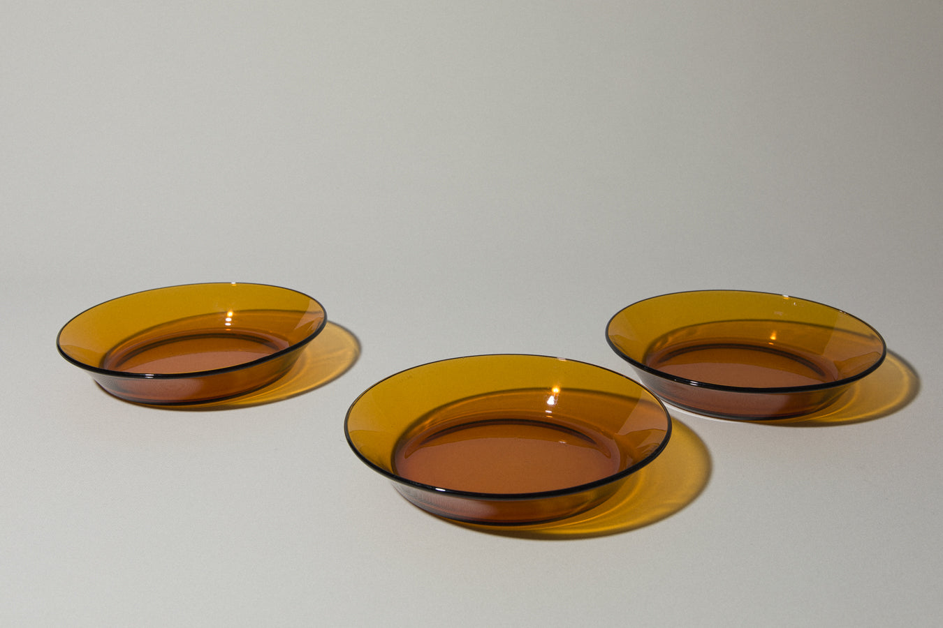 Set of three amber SOUP PLATES