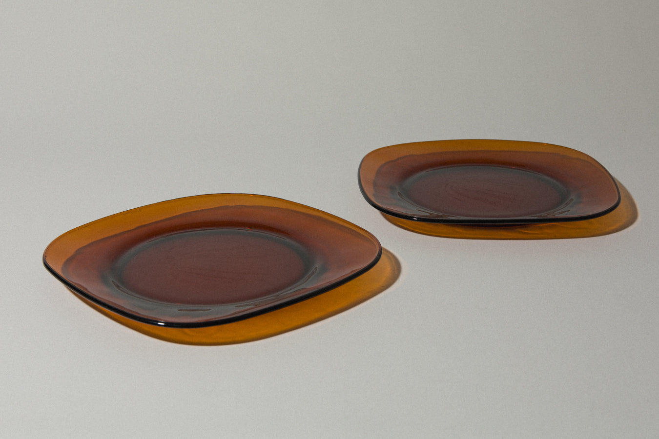 Set of two amber glass SERVING PLATES