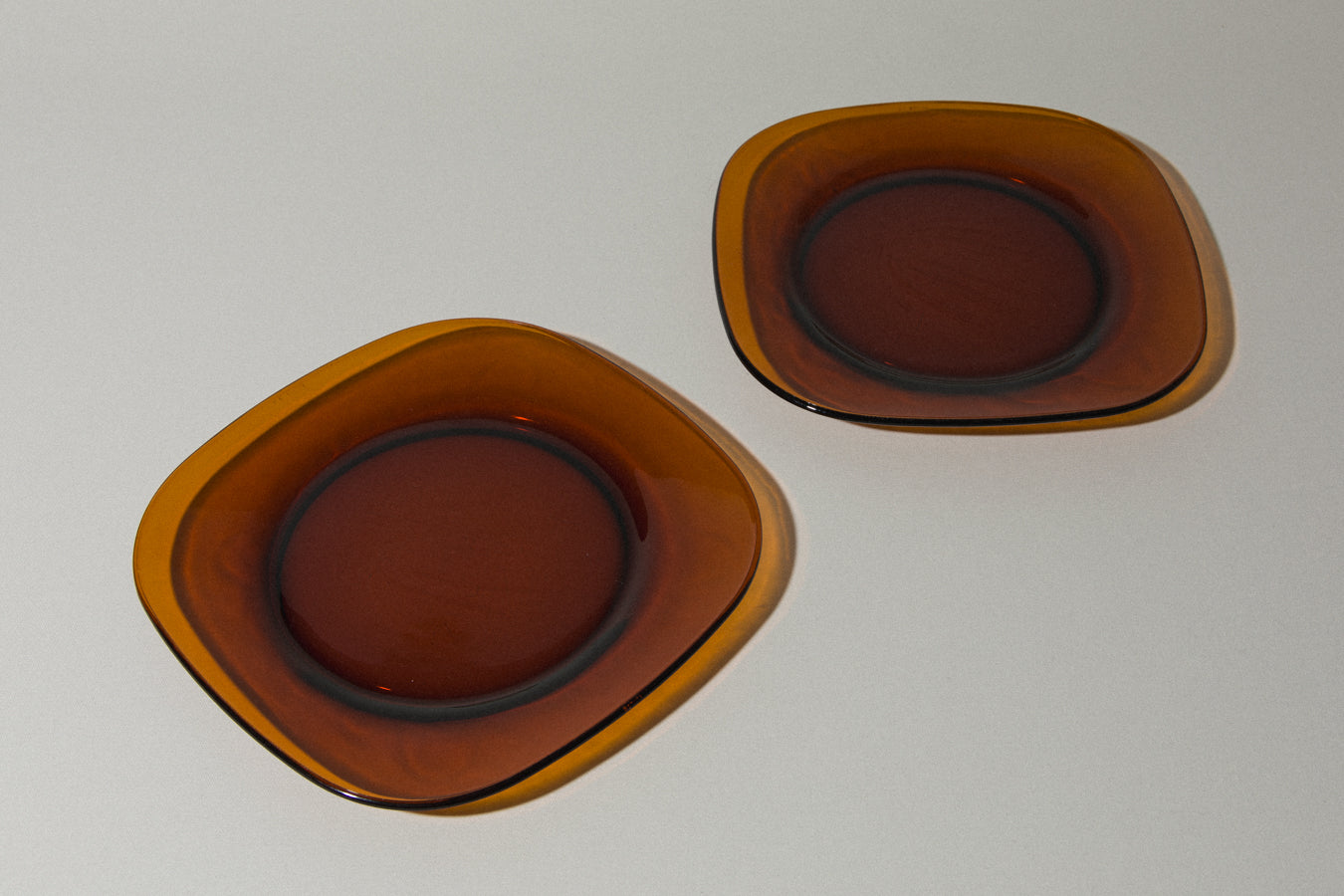 Set of two amber glass SERVING PLATES