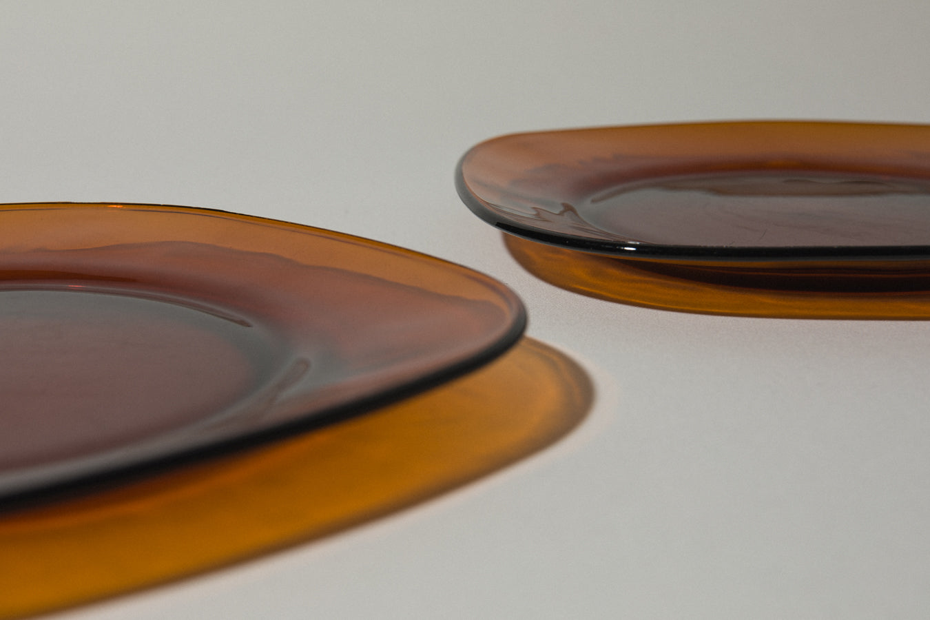 Set of two amber glass SERVING PLATES