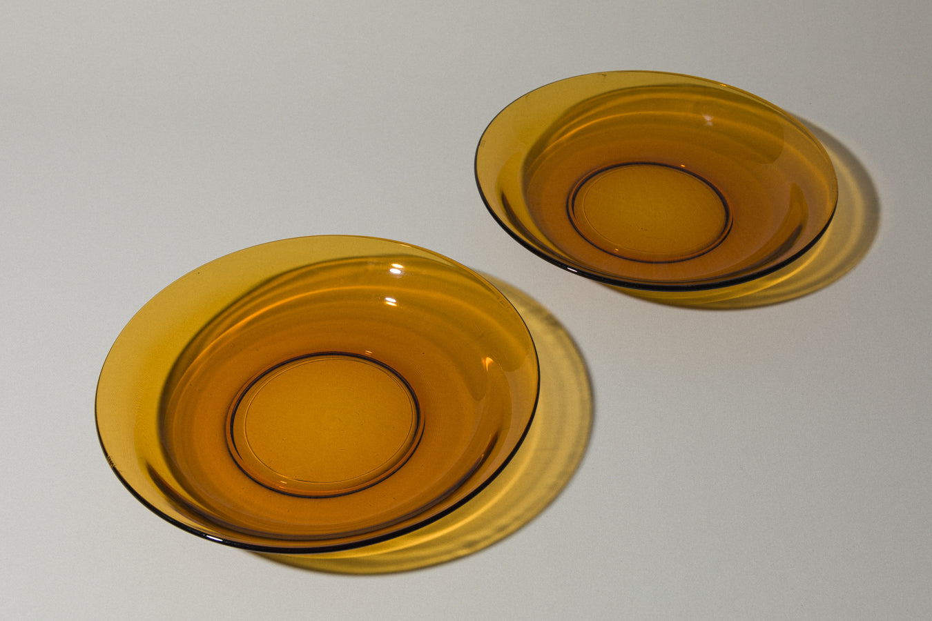 Set of two amber glass SERVING BOWLS
