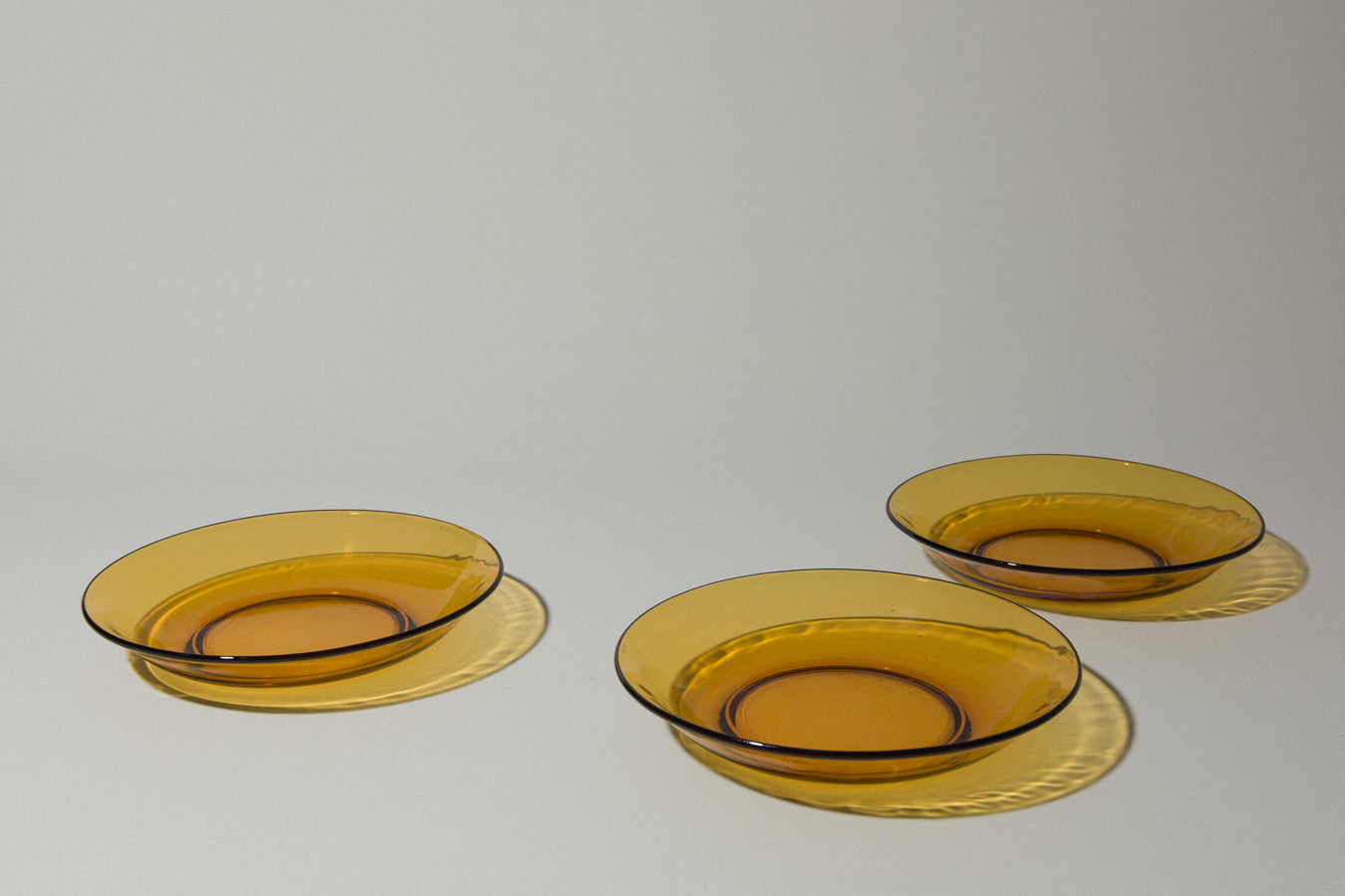 Set of three amber glass SOUP PLATES