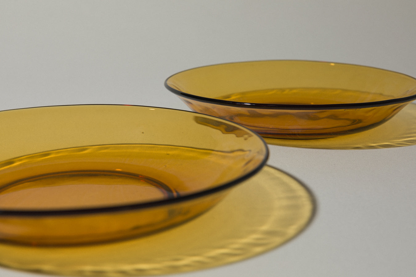 Set of three amber glass SOUP PLATES