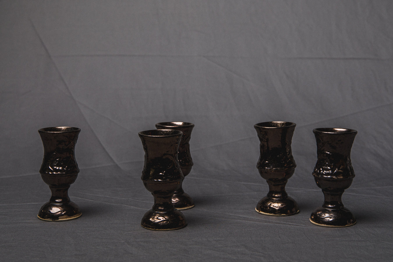 Set of five religious-themed faience CUPS