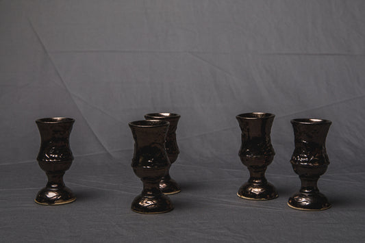 Set of five religious-themed faience CUPS