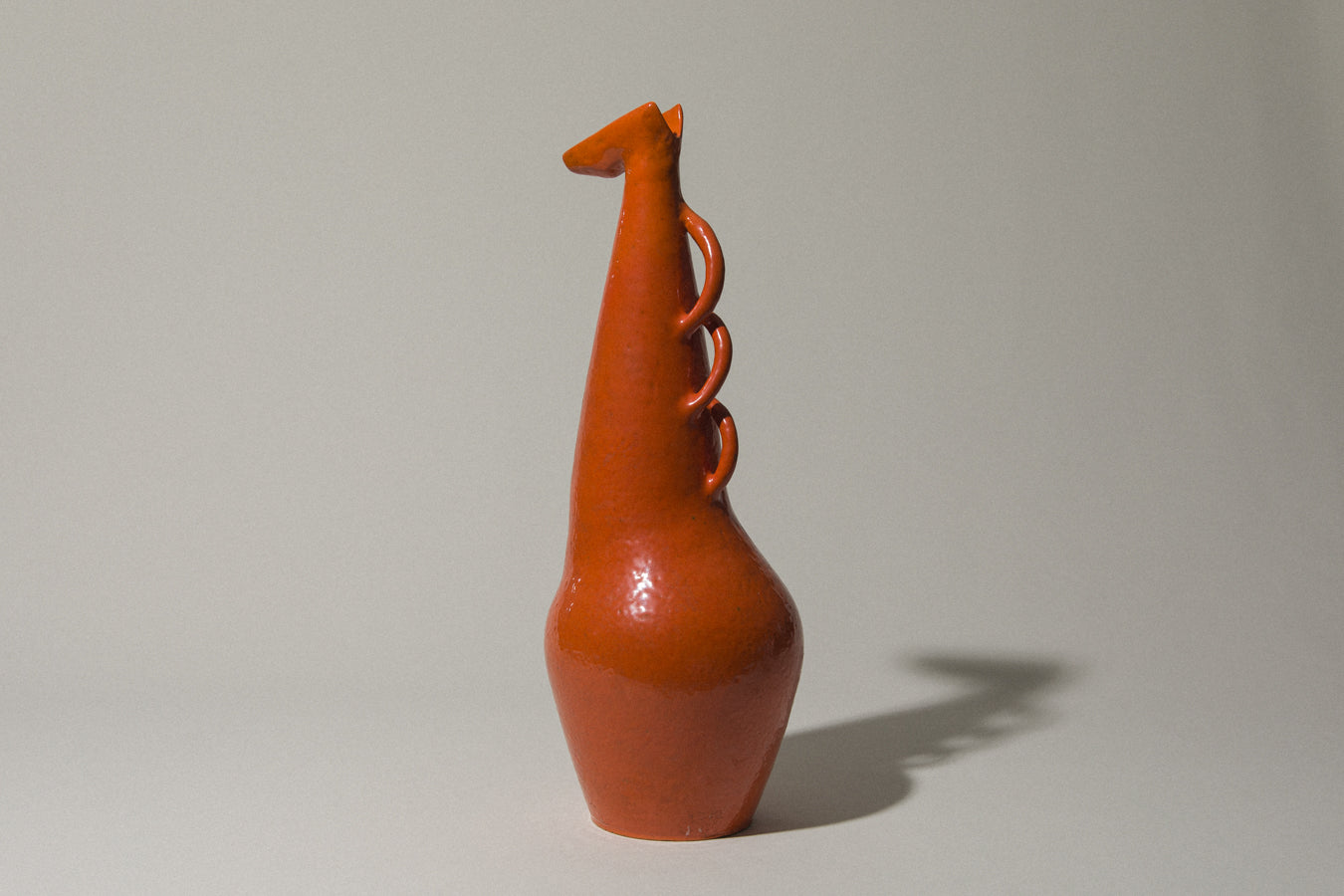 Orange giraffe-shaped VASE by István Gádor