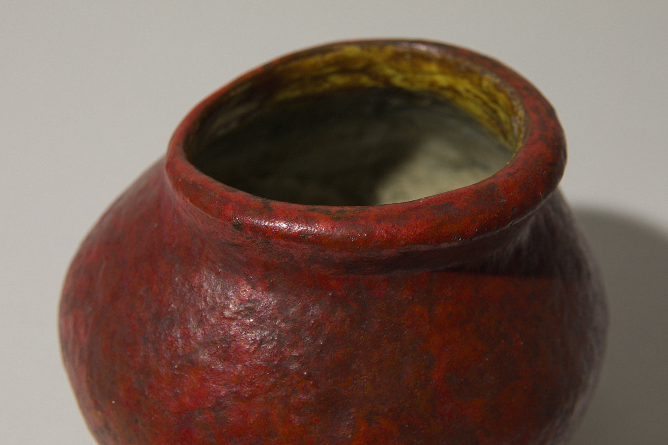 Low wide-mouthed VASE in dark orange by István Gádor