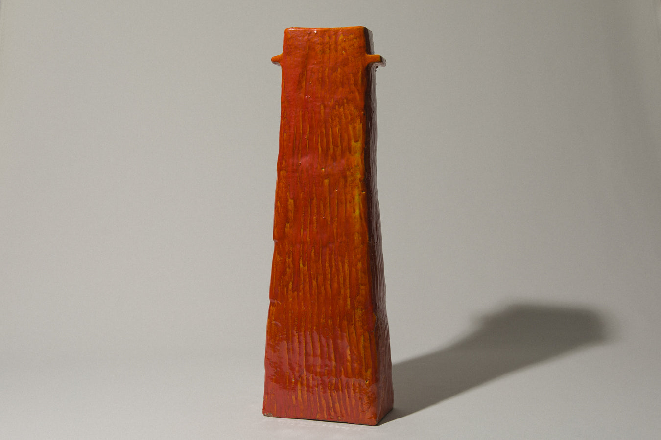 Orange rectangular VASE with handles by Béla Mihály