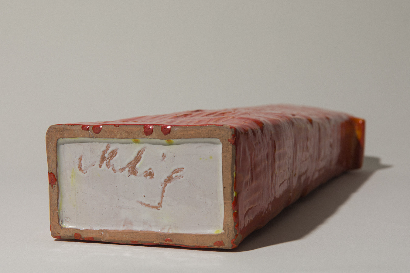 Orange rectangular VASE with handles by Béla Mihály