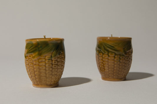 Set of two beeswax CANDLE in corn-motif faience holder