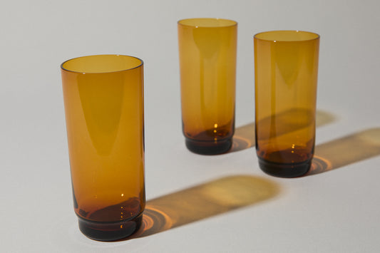 Set of three amber drinking GLASSES tall