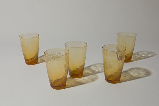 Set of five amber textured glass TUMBLERS