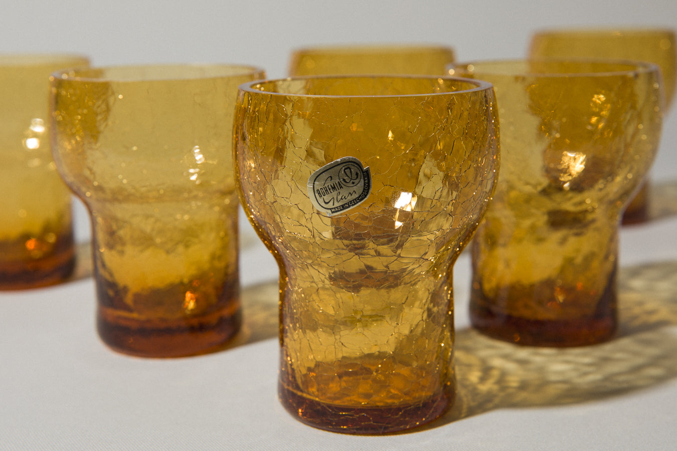 Set of seven crackled amber glass TUMBLERS