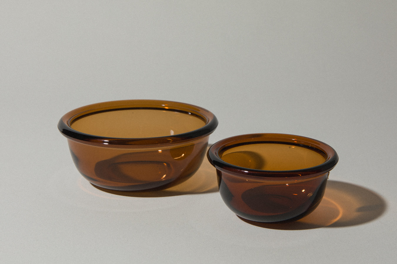 Set of two amber glass BOWLS