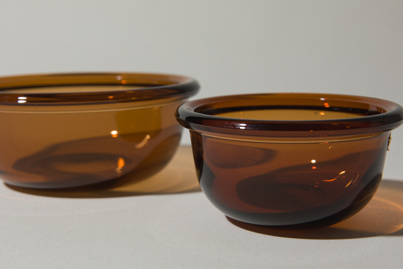 Set of two amber glass BOWLS