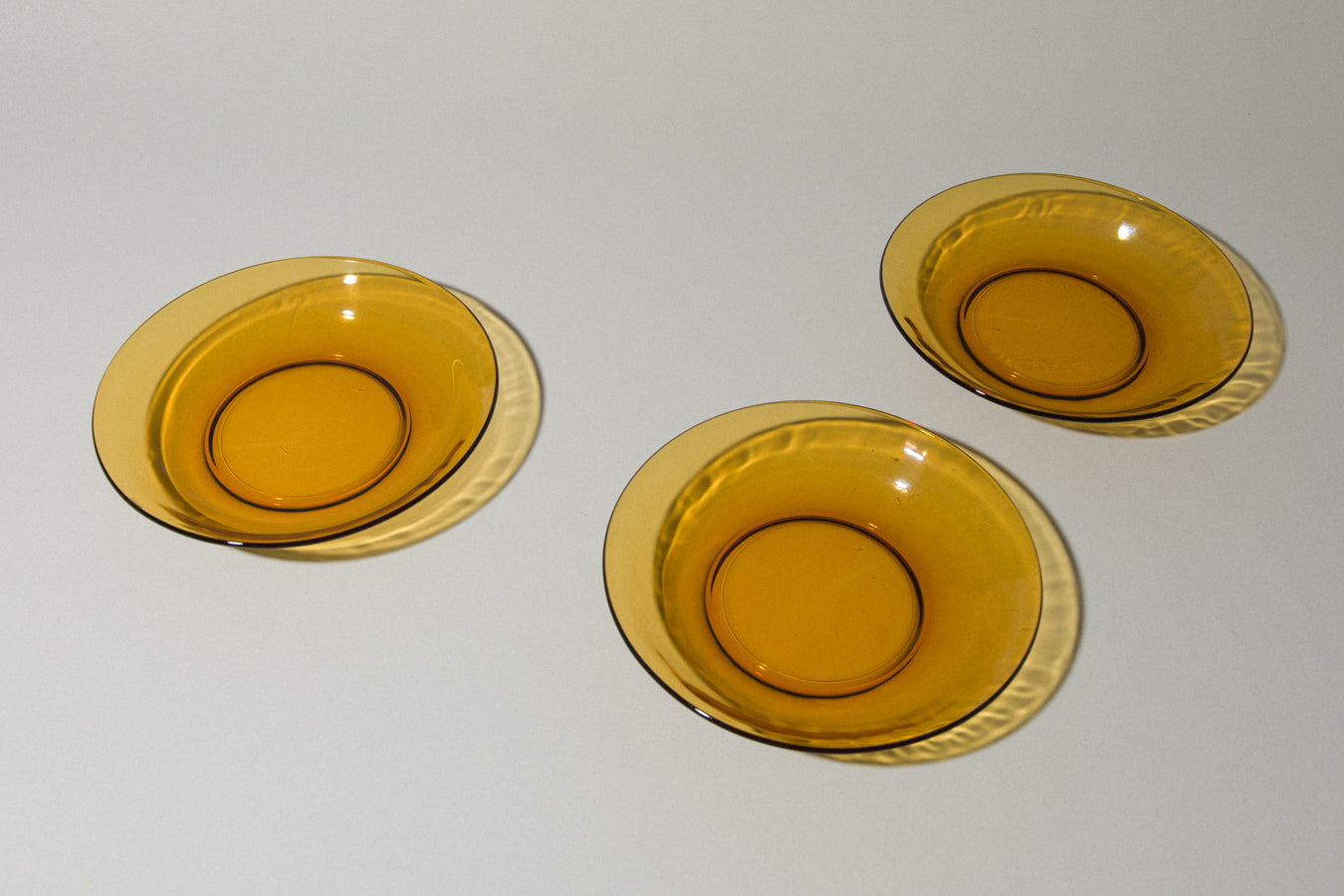 Set of three amber glass SOUP PLATES